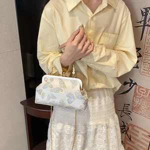 Ethnic style butterfly embroidered crossbody bag with gold chain and clasp closure