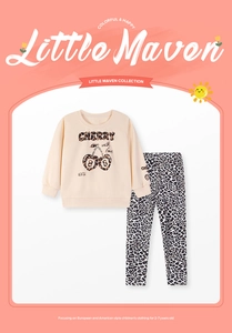 Detail of girls beige sweatshirt with leopard cherry print and matching leopard pants