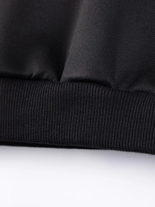 Detailed macro view of black Christmas girls sweatshirt ribbed cuffs and knit texture