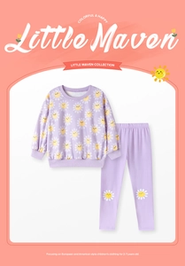 Detailed view of the purple girls' outfit featuring daisy prints on the knee and sleeves