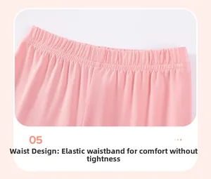 Detail of the high-elastic waistband on pink knitted cotton trousers for girls