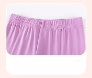 Detail of high-elastic waistband on purple knitted girls' leggings for comfort