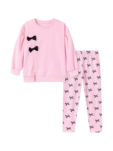 Ensemble rose pour petite fille avec haut à manches longues et nœuds noirs