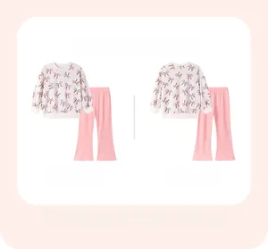 Front and back view of girls cotton floral pajama set with bow pattern and pink pants