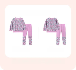 Front and back view of girls' purple pajama set with cartoon rabbit prints and ribbed cuffs