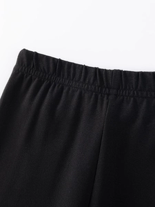 Girls' autumn black cotton leggings featuring a flexible elastic waistband and smooth seams