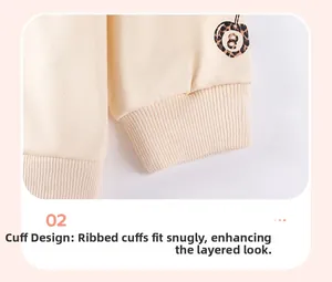 Detail of ribbed cuffs on beige knit sweatshirt for girls with leopard number 8 print