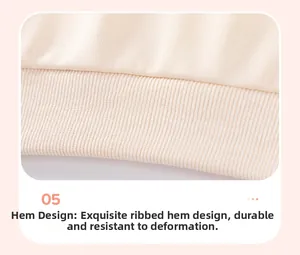 Detailed close-up of beige knitted girl's top featuring a high-elastic ribbed hem design