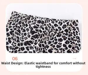 Detail of elastic waistband on girls' cotton leopard print trousers with comfortable fit