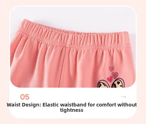 Detail of girls' pink trousers featuring elastic waistband and leopard heart print