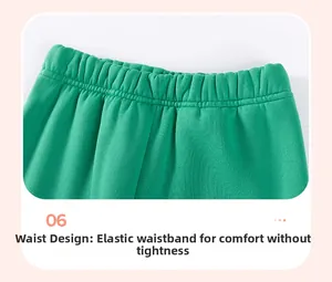 Detail of elastic waistband on green knitted boys' trousers with comfortable ribbing
