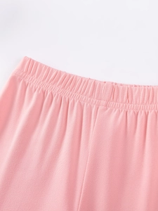 Girl's pink autumn knit pants with elastic waistband and high-quality stitching details