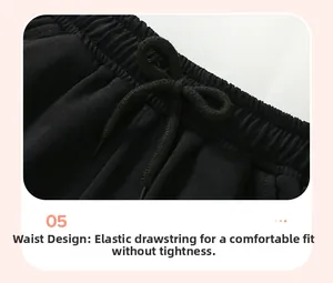 Détail du pantalon de sport garçon avec taille élastique et cordon de serrage noir