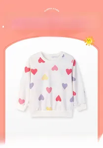 Detail of white cotton sweatshirt featuring vibrant pink, purple, and yellow heart patterns