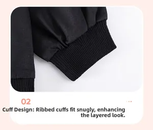 Detail of ribbed cuffs on black long-sleeve cotton boy's shirt for a comfortable fit