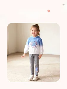 Detail view of girls blue gradient hoodie with cute bunny print and grey trousers