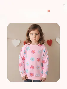 Detailed view of pink cotton floral pattern on long-sleeved girls sweatshirt with ribbed cuffs