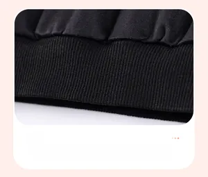 Close-up of black ribbed texture on boys' cotton shirt hem with durable knit details