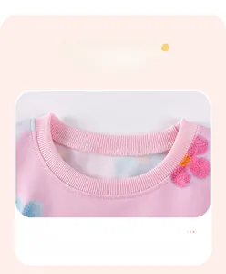 Detail of pink floral sweatshirt featuring ribbed neckline and reinforced stitching