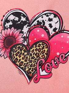 Pink girls outfit featuring multi-patterned heart print with Love text and sunflower