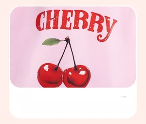 Detail of pink knit sweater showing a red cherry graphic and cherry text print