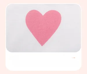 Detail of pink heart print on white cotton fabric with knit texture for girls sweatshirt
