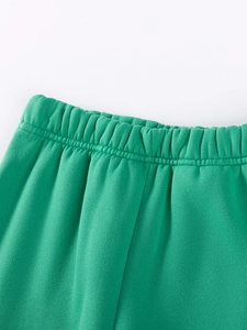 Green fleece dinosaur set for boys featuring an elastic waistband and soft knit fabric