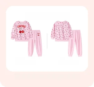 Detail of pink cherry print kids loungewear set with soft ribbed cuffs and neckline