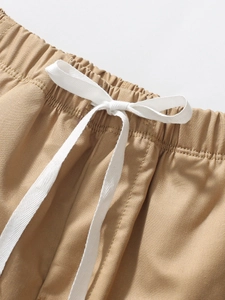 Boys khaki summer shorts with elastic waistband and white drawstring detail
