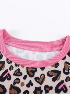 Pink ribbed crewneck girls' top with leopard and heart pattern print detail
