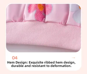Close-up of pink girls sweatshirt featuring ribbed hem and floral pattern detail