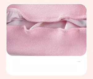 Close-up of pink ribbed cuffs and high-quality double-needle stitching on girl's sweatshirt