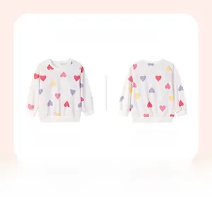 Detailed front and back view of a girls' cream sweatshirt with colorful heart patterns
