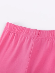 Pink elastic waistband of long-sleeved girls' cotton trousers with precise stitching detail