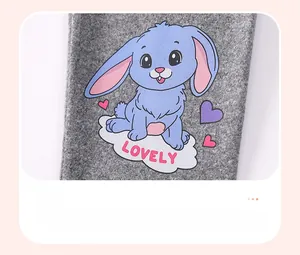 Detail of grey knitted fabric with cartoon rabbit print and Lovely text for girl sets