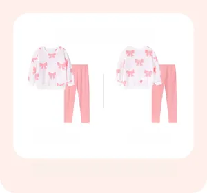 Dettaglio del set per bambine con top bianco a fiocchi e pantaloni rosa abbinati