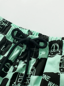 Pantaloncini estivi in cotone per bambini verde menta con stampe bus e scacchi