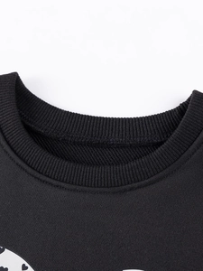 Girl's long sleeve autumn set featuring black ribbed crewneck and heart print detail