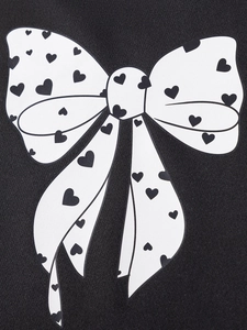 Fall girls long sleeve outfit with large white bow and heart print on black fabric