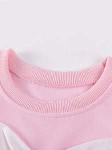Robe en tricot rose pour fille avec col rond côtelé renforcé et finitions de qualité
