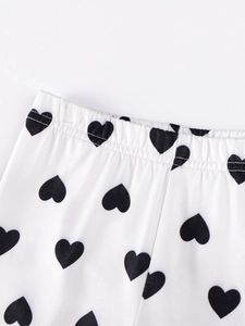 Girl's autumn long sleeve outfit featuring white cotton pants with black heart prints