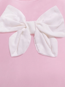 Robe rose à manches longues pour fille en coton avec un grand nœud décoratif blanc