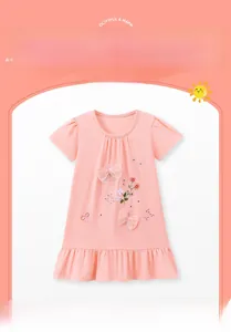 Detailed embroidery and 3D mesh bows on a pink cotton summer dress for girls