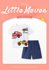 Flat lay of boys white cartoon race car t-shirt and navy cotton shorts summer outfit