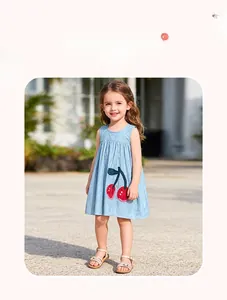 Detail of light blue sleeveless denim dress for girls featuring cute cherry embroidery