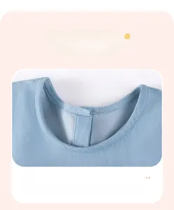 Detail view of denim dress neckline showing durable double-needle stitching and snap buttons