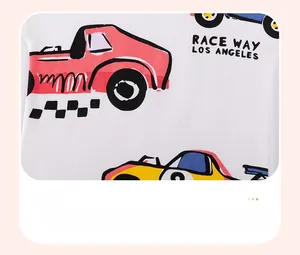 Detail of high-quality cotton fabric with vibrant cartoon race car prints for kids