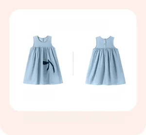 Girls denim sleeveless dress featuring cherry embroidery and wooden button back detail