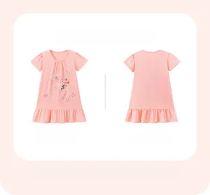 Detail of pink cotton girl dress with 3D bow, floral embroidery and ruffled hemline