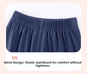 Detail of wide elastic waistband with fine stitching on navy blue cotton kids pants